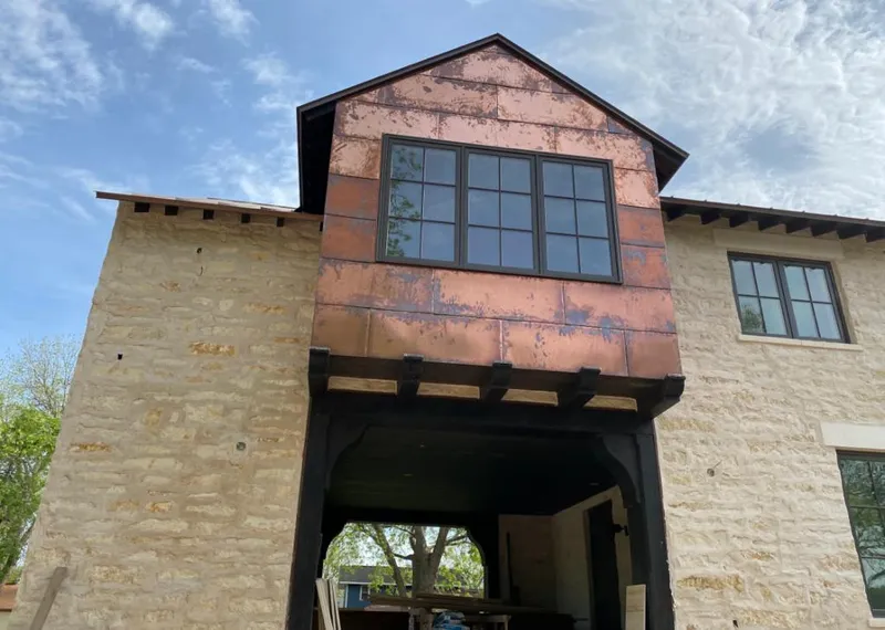 Copper metal panel facade on a stone building for Skylight Installation in Maple Shade